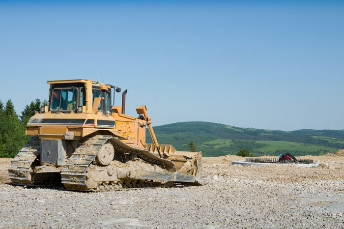 a bulldozer on a dirt road